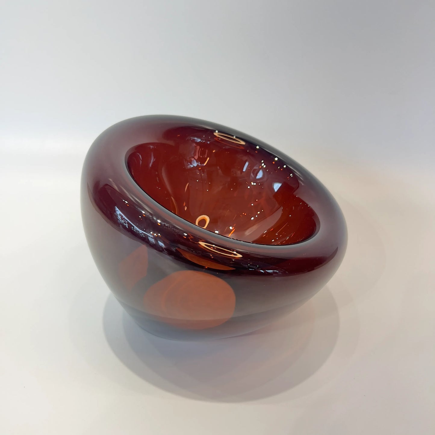 Glossy brown decorative bowl on a white background