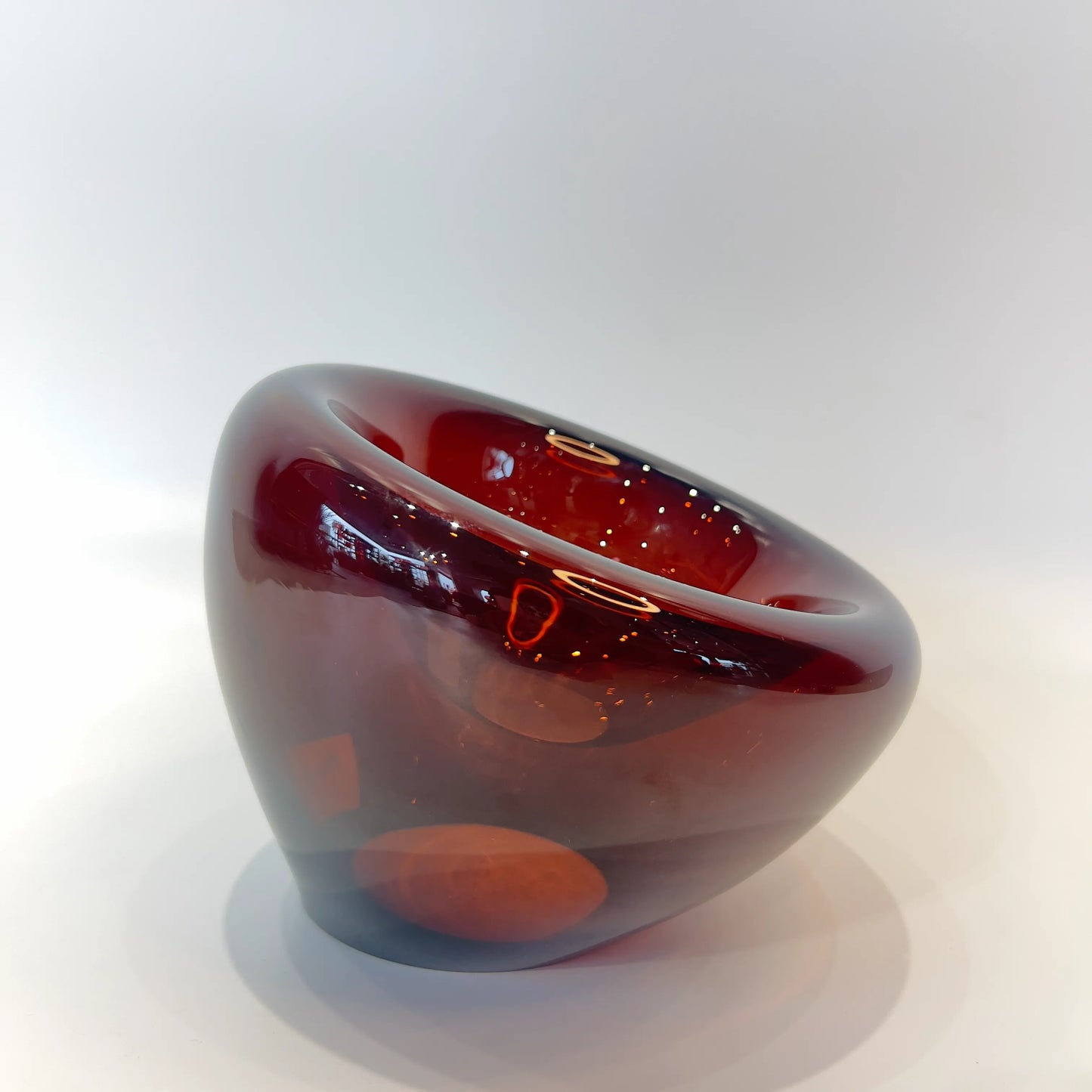 Decorative Red glass bowl on a white background available at Fabcuro, the best home decor store in Bangalore