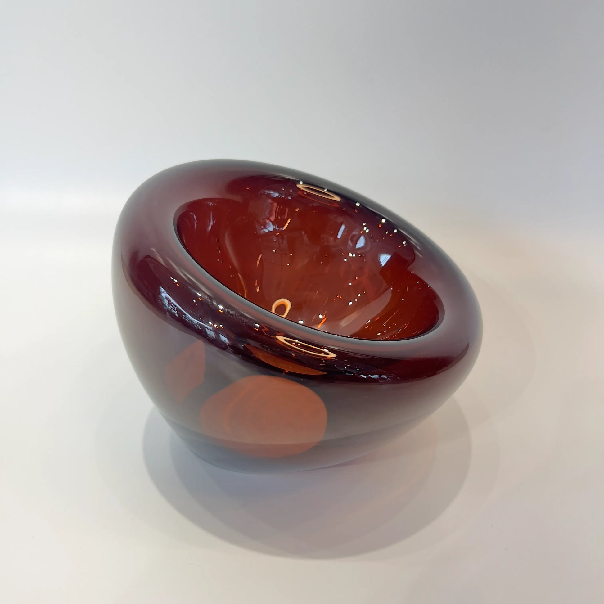 Glossy brown decorative bowl on a white background