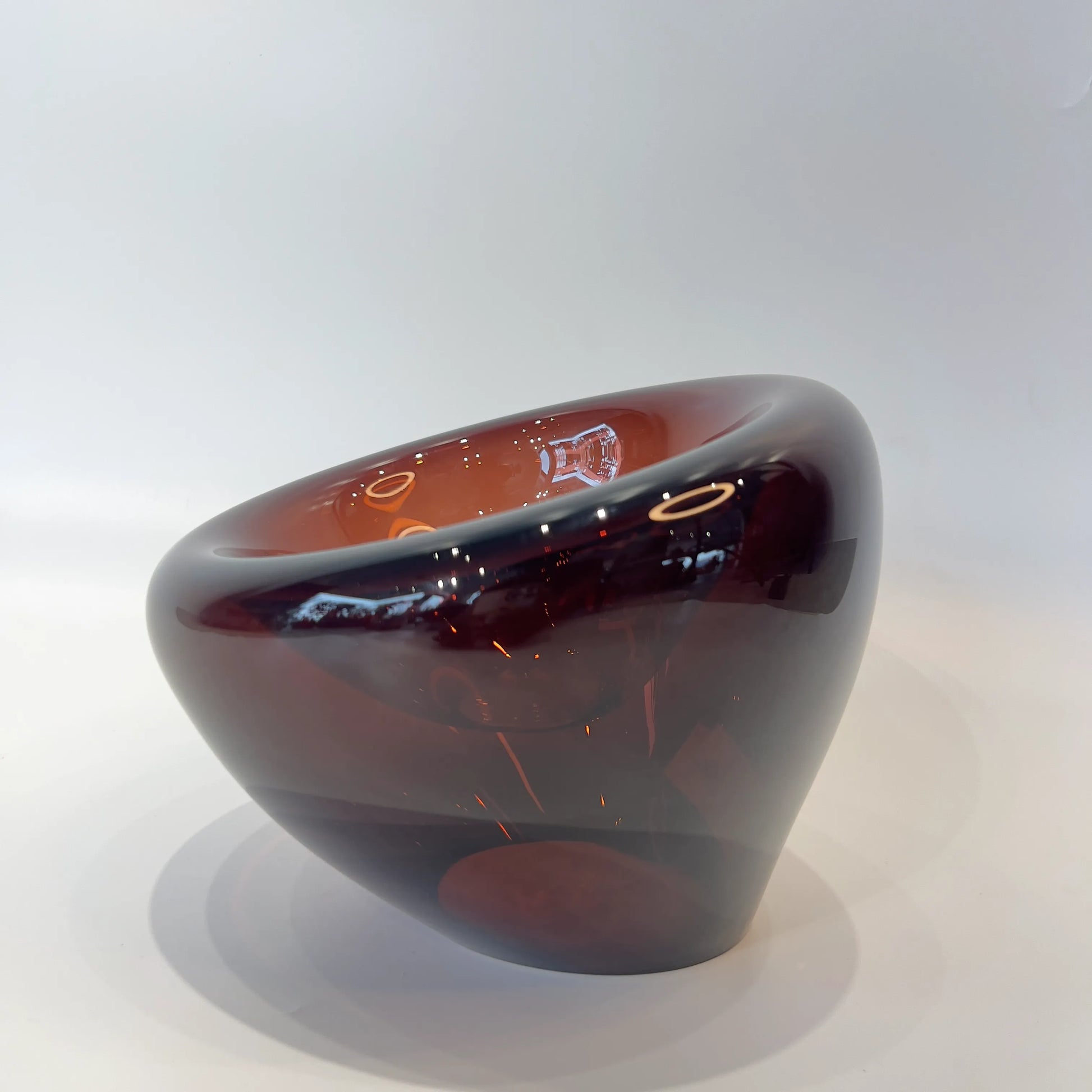 Decorative Glass bowl with a gradient color from brown to black on a white background available at FabCuro, best home decor store in Bangalore 
