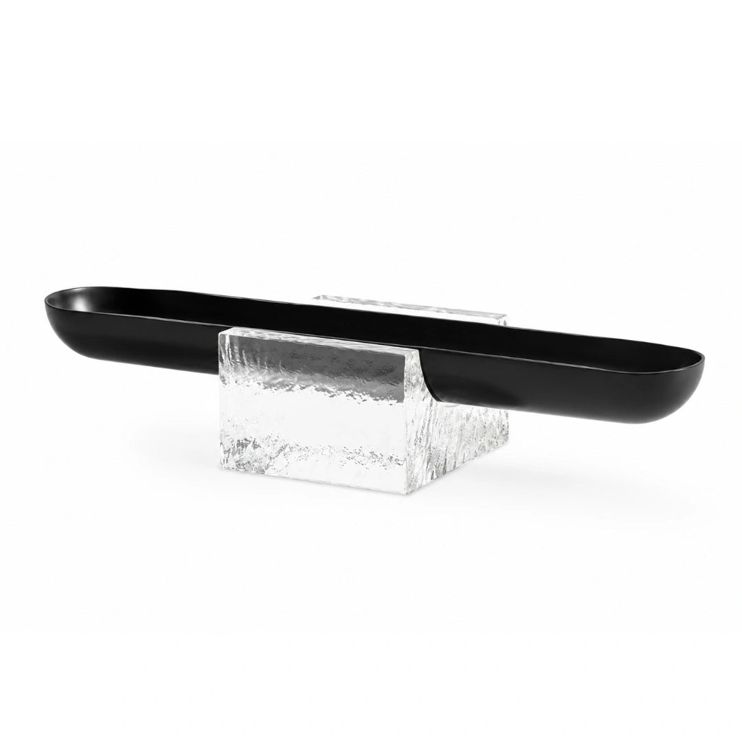 The Mystic Crystal Tray combines a sleek metal tray with a textured crystal glass base, creating a striking balance of functionality and contemporary design.