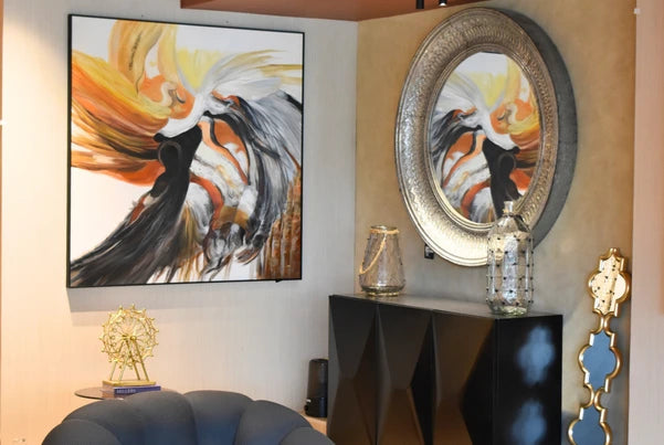 FabCuro home decor store in Kasturi Nagar, Bangalore, showcasing home decor items including an abstract wall painting, ornate oval wall mirror, black console table, decorative vases, and a tufted accent chair.